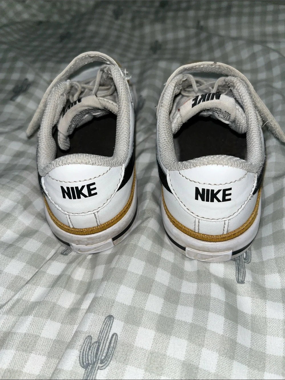 Nike Kids White Low-Top Sneakers with Black Swoosh and Mustard Trim